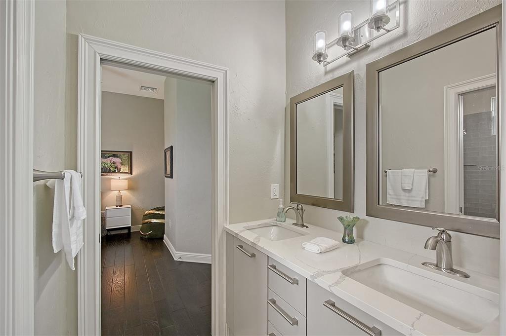 520 Rye Road Northeast Bradenton, FL 34212 - Photo 46 of 88 a en suite bathroom with a sink double vanity and a mirror