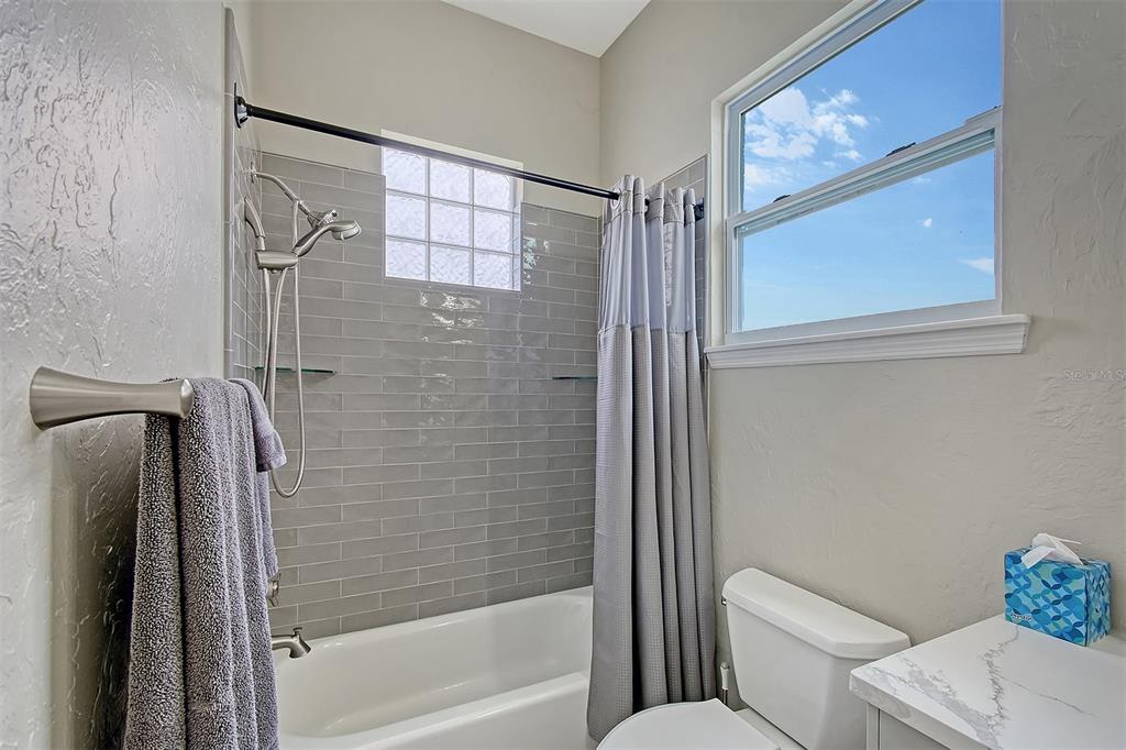 520 Rye Road Northeast Bradenton, FL 34212 - Photo 53 of 88 a bathroom with a shower a toilet and a shower