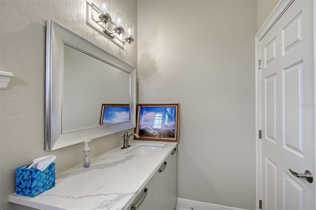 520 Rye Road Northeast Bradenton, FL 34212 - Photo 54 of 88 a bathroom with a sink and a mirror