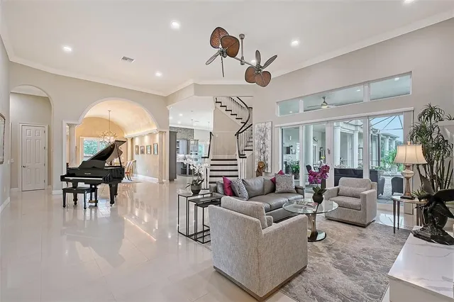 a living room with furniture a window and a fireplace