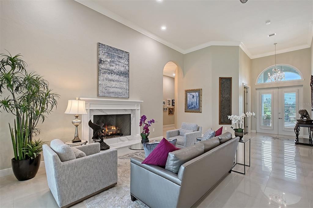 520 Rye Road Northeast Bradenton, FL 34212 - Photo 9 of 88 a living room with furniture and a fireplace