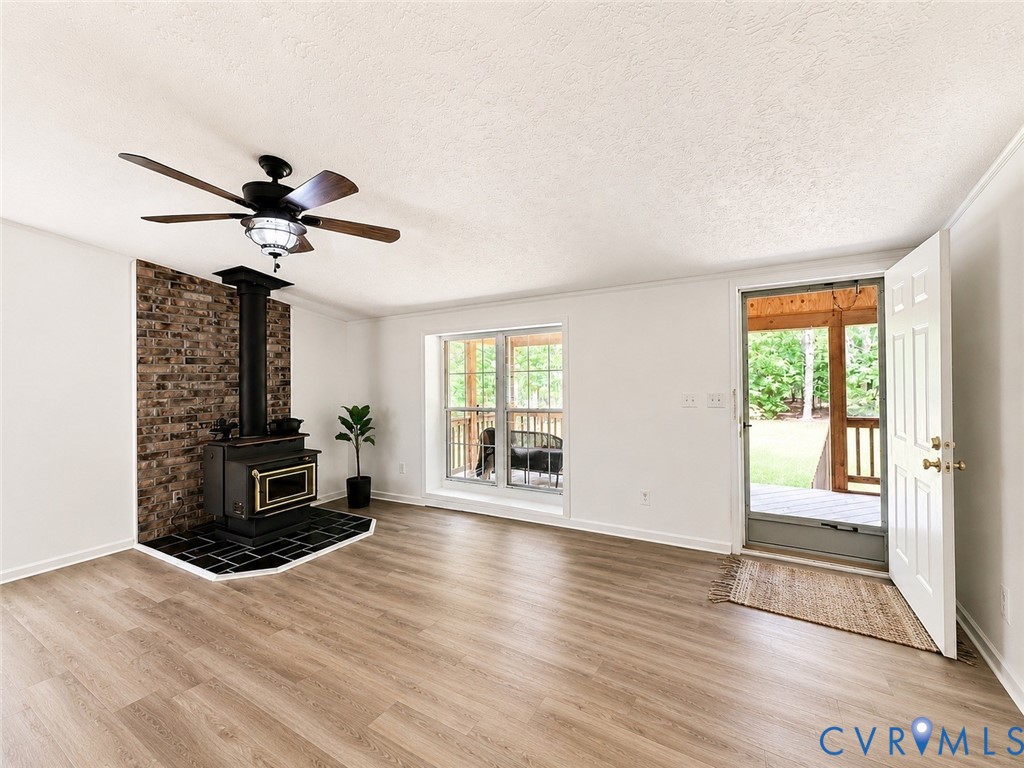 2229 Texas School Road Wingina, VA 24599 - Photo 12 of 22 Spacious living room with wood stove, abundant nat
