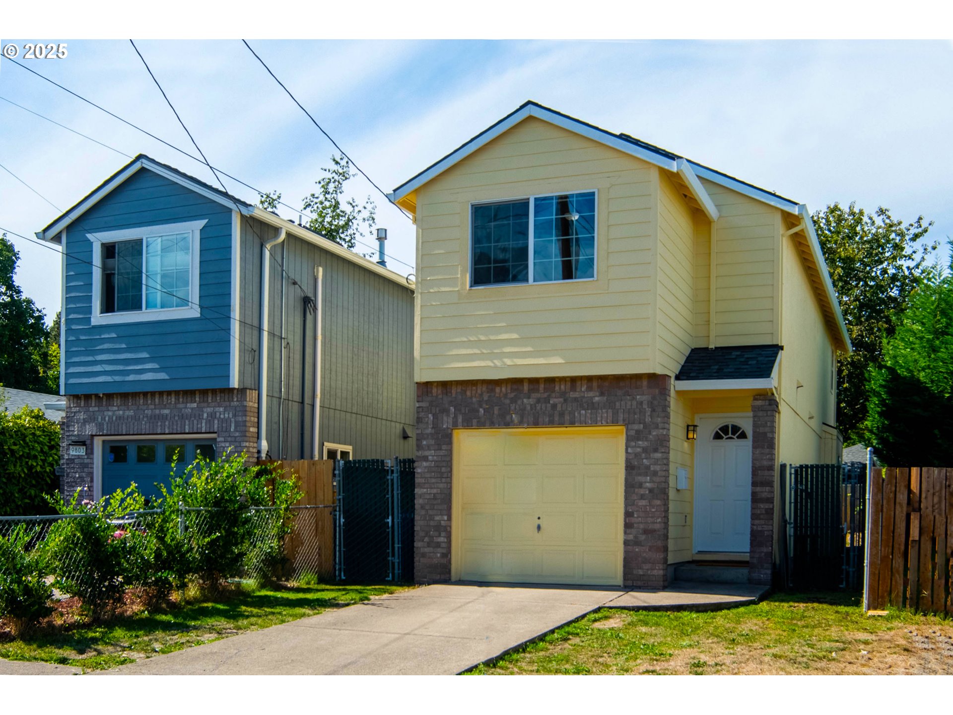 9809 North Exeter Avenue Portland, OR 97203 - Photo 1 of 31 a front view of a house with a yard