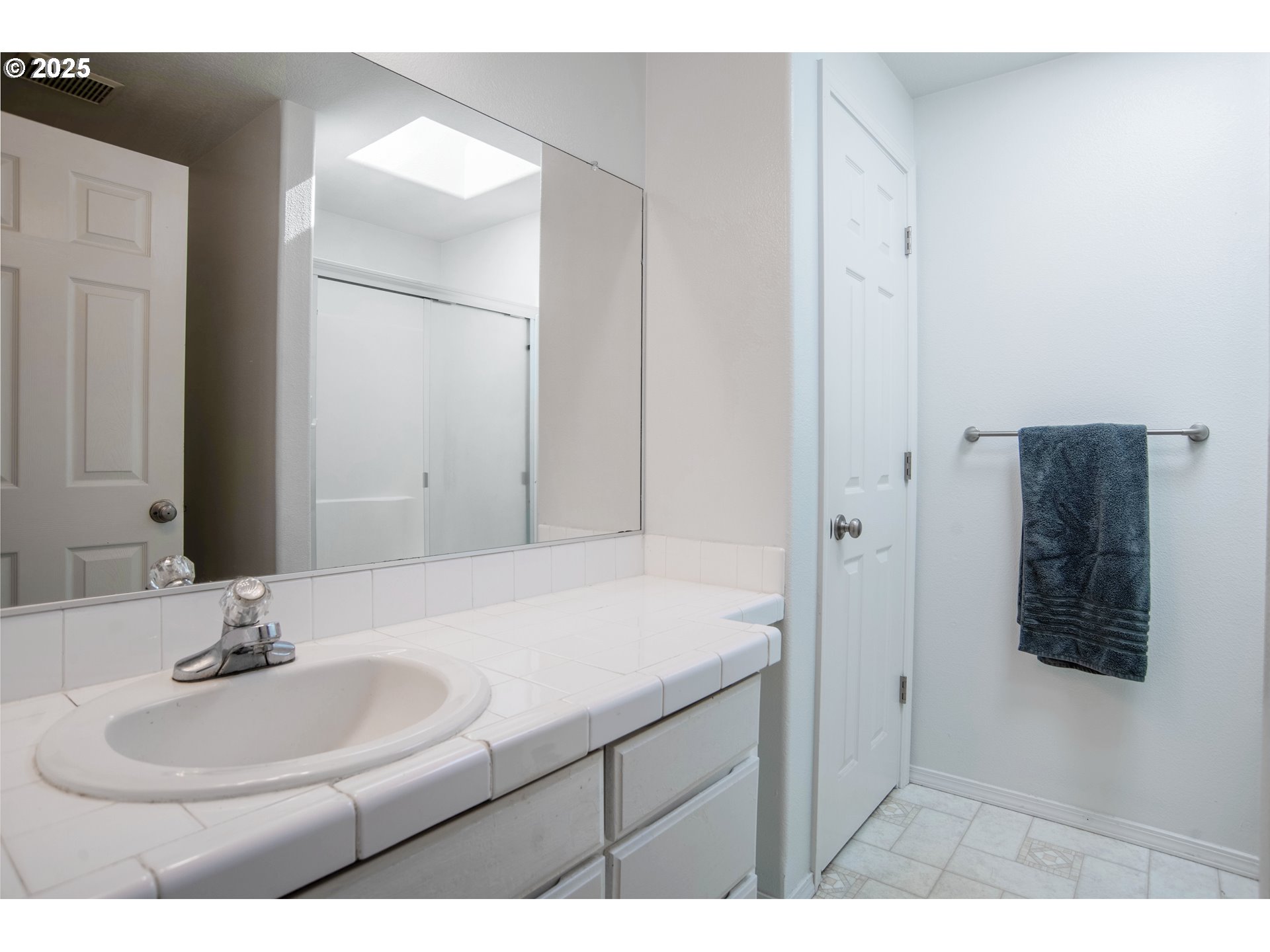 9809 North Exeter Avenue Portland, OR 97203 - Photo 15 of 31 a bathroom with a sink and a mirror
