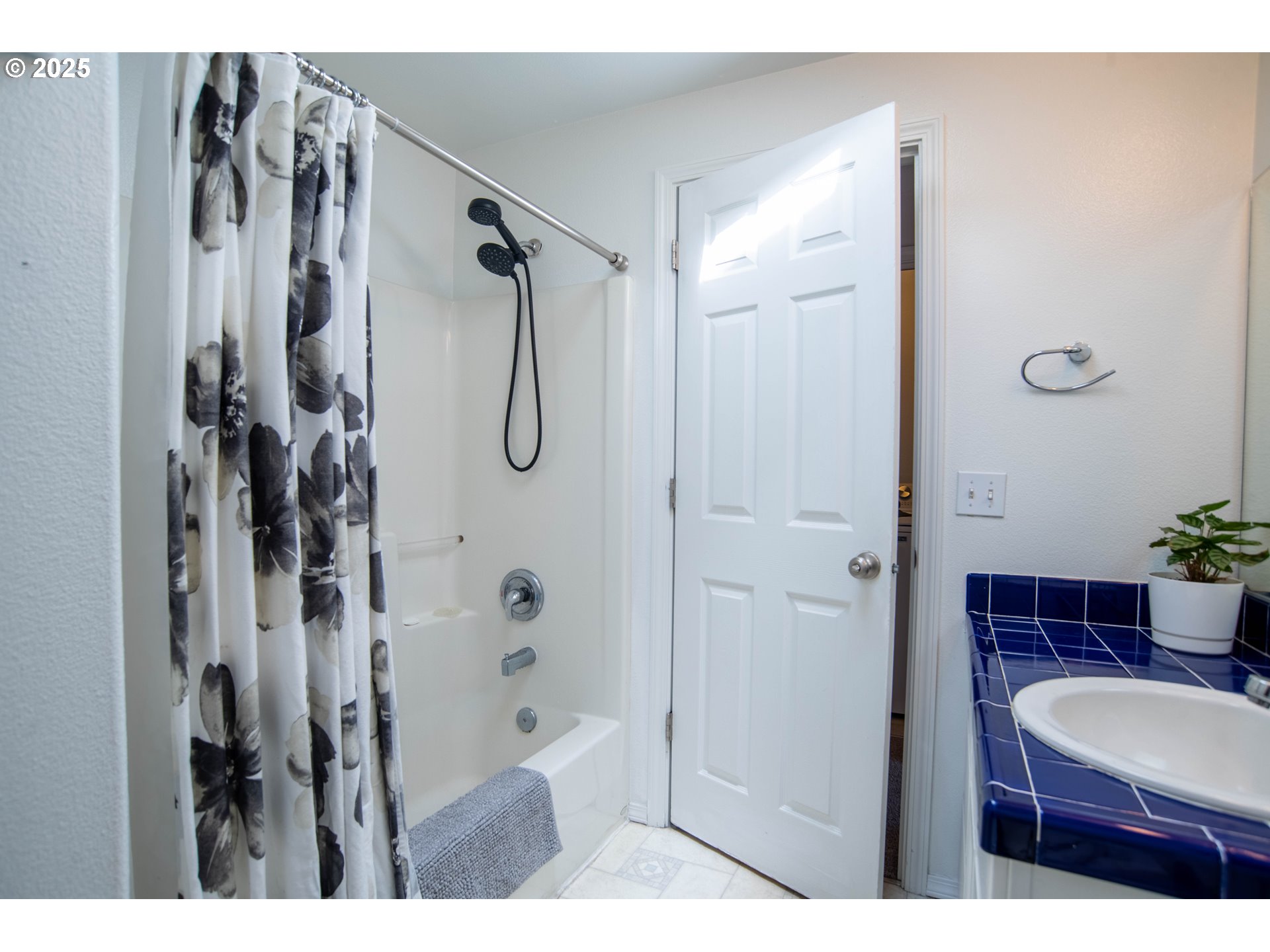 9809 North Exeter Avenue Portland, OR 97203 - Photo 21 of 31 a bathroom with a shower and a sink