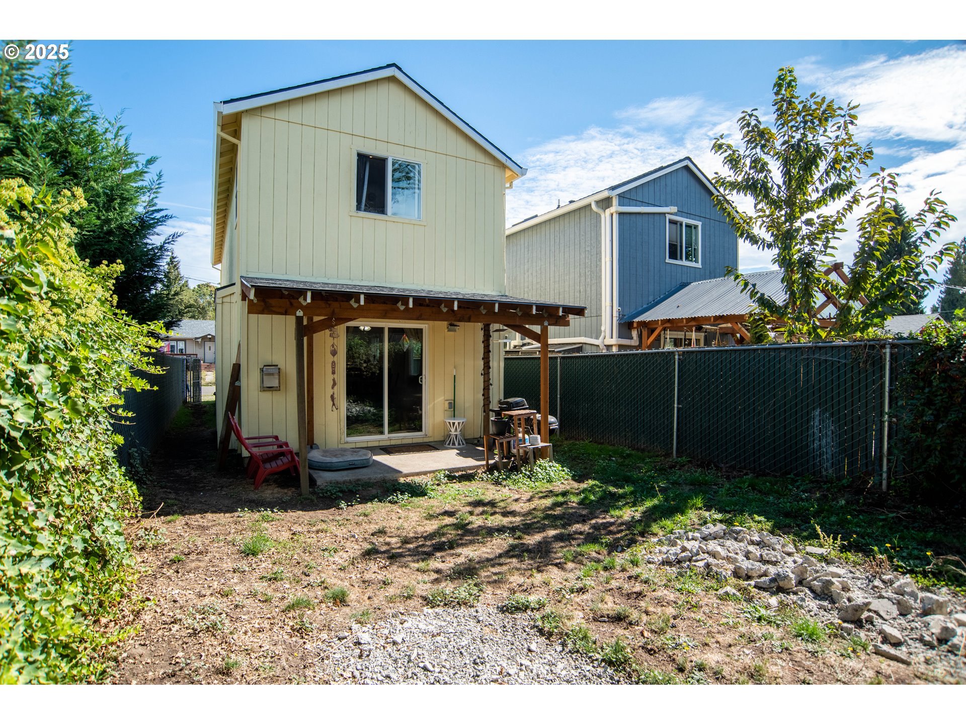 9809 North Exeter Avenue Portland, OR 97203 - Photo 27 of 31 a view of a house with a yard