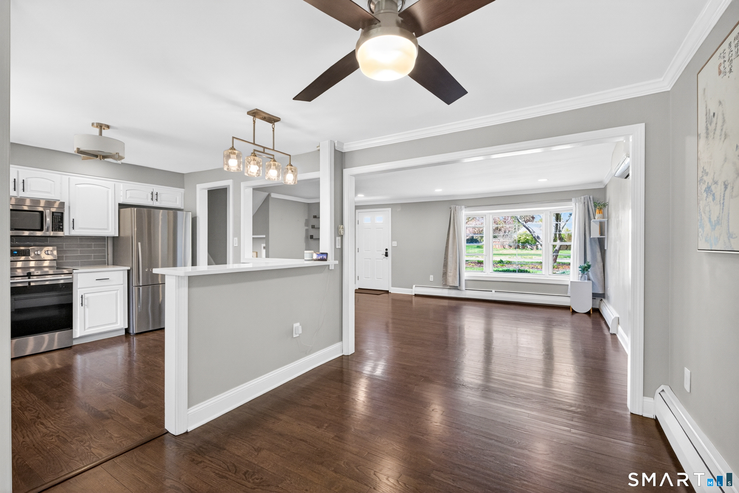 568 Wiese Road Cheshire, CT 06410 - Photo 8 of 40 a view of a kitchen with a stove cabinets and wooden floor