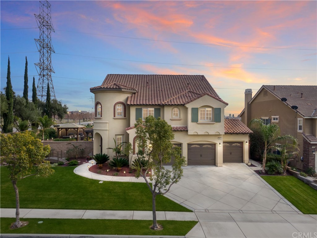 a front view of a house with a yard table and chairs