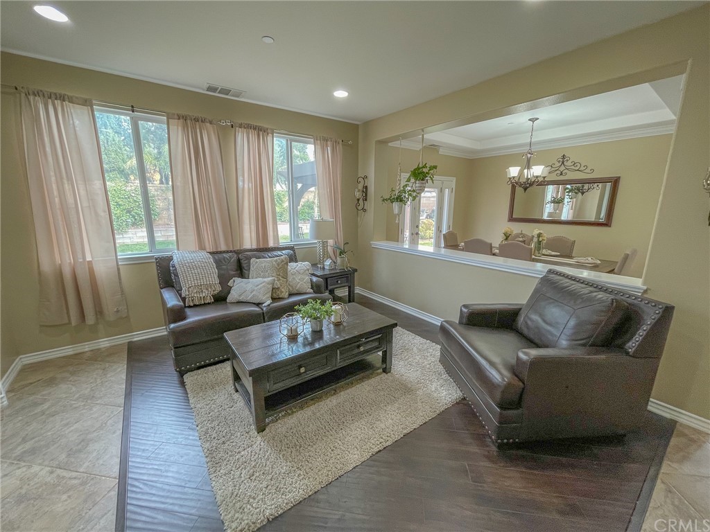5381 Campania Way Fontana, CA 92336 - Photo 16 of 45 a living room with furniture and wooden floor