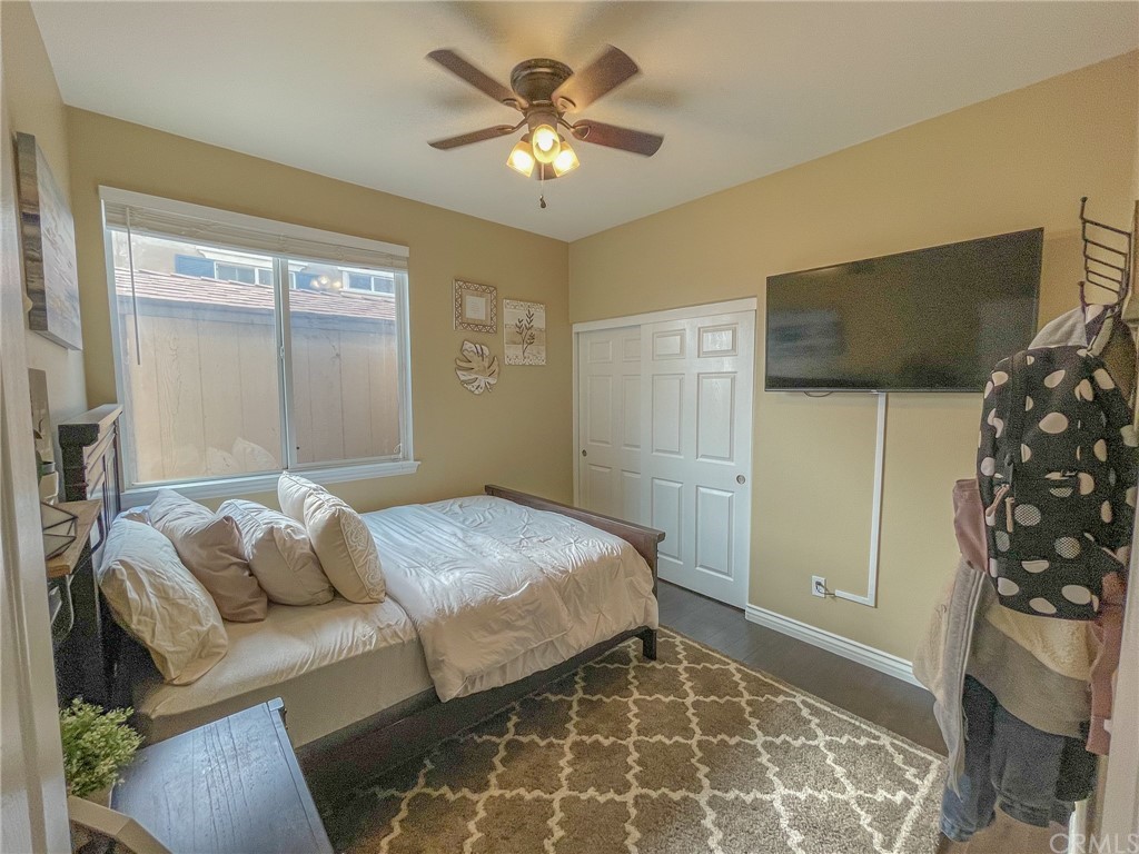 5381 Campania Way Fontana, CA 92336 - Photo 17 of 45 a bedroom with a bed and a window