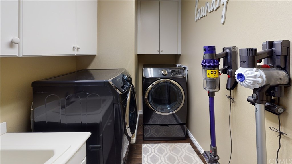 5381 Campania Way Fontana, CA 92336 - Photo 18 of 45 a utility room with sink dryer and washer