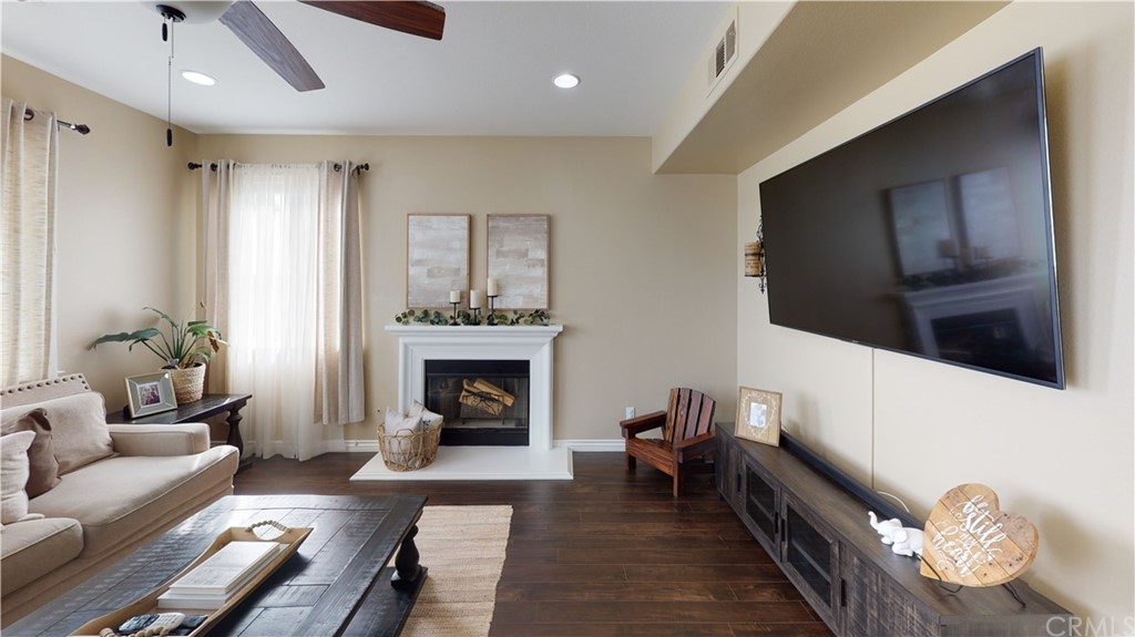 5381 Campania Way Fontana, CA 92336 - Photo 20 of 45 a living room with furniture and a fireplace