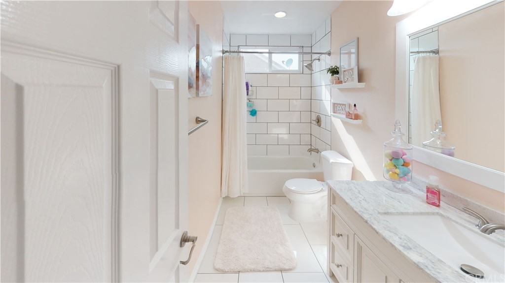 5381 Campania Way Fontana, CA 92336 - Photo 22 of 45 a bathroom with a sink toilet vanity and shower