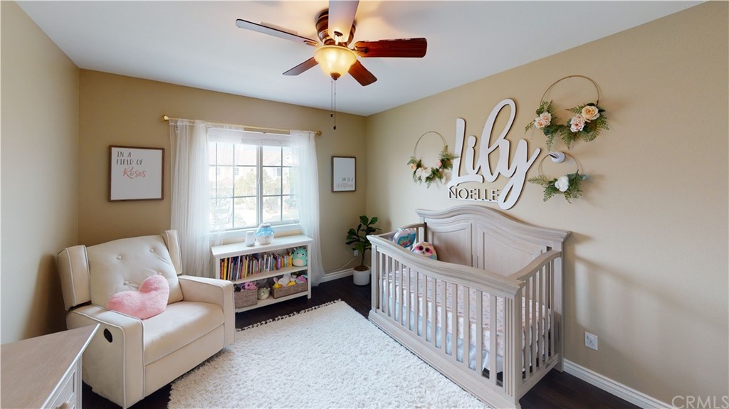 5381 Campania Way Fontana, CA 92336 - Photo 23 of 45 a bedroom with furniture and a window