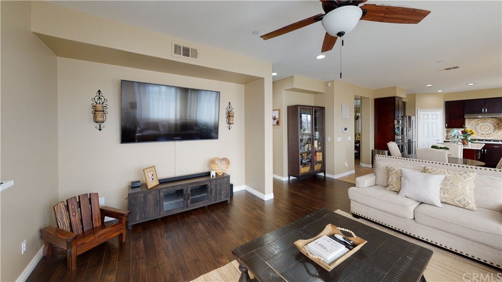 5381 Campania Way Fontana, CA 92336 - Photo 24 of 45 a living room with furniture and a flat screen tv