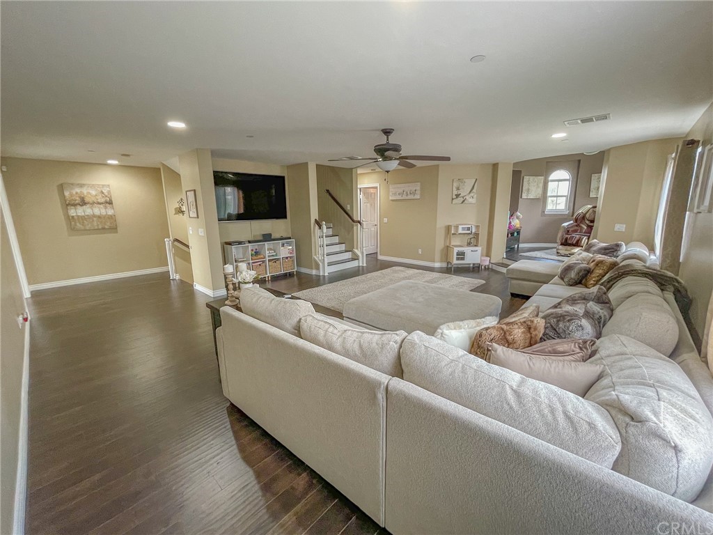 5381 Campania Way Fontana, CA 92336 - Photo 26 of 45 a living room with furniture and a flat screen tv