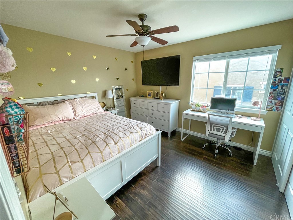 5381 Campania Way Fontana, CA 92336 - Photo 32 of 45 a bedroom with a bed and a flat screen tv