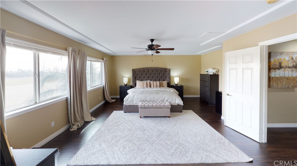 5381 Campania Way Fontana, CA 92336 - Photo 36 of 45 a spacious bedroom with a bed and a window