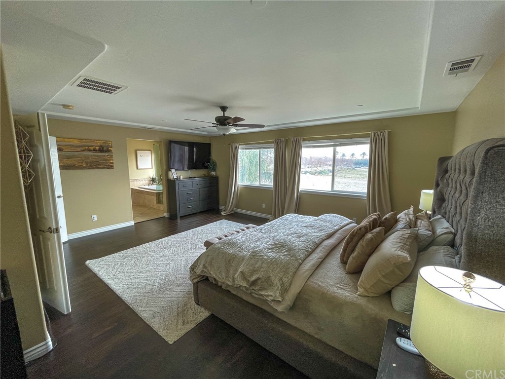 5381 Campania Way Fontana, CA 92336 - Photo 39 of 45 a bedroom with a bed and a dresser in it