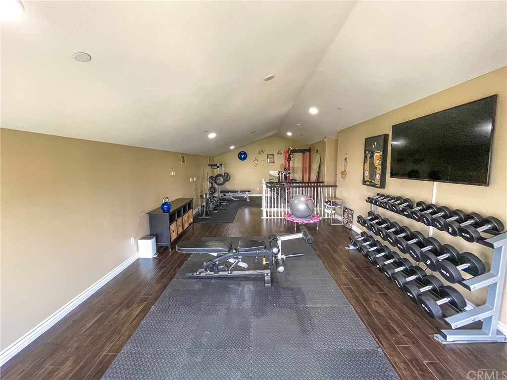 5381 Campania Way Fontana, CA 92336 - Photo 45 of 45 a living room with furniture and a flat screen tv