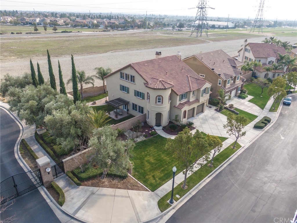 5381 Campania Way Fontana, CA 92336 - Photo 5 of 45 an aerial view of a house with outdoor space and lake view