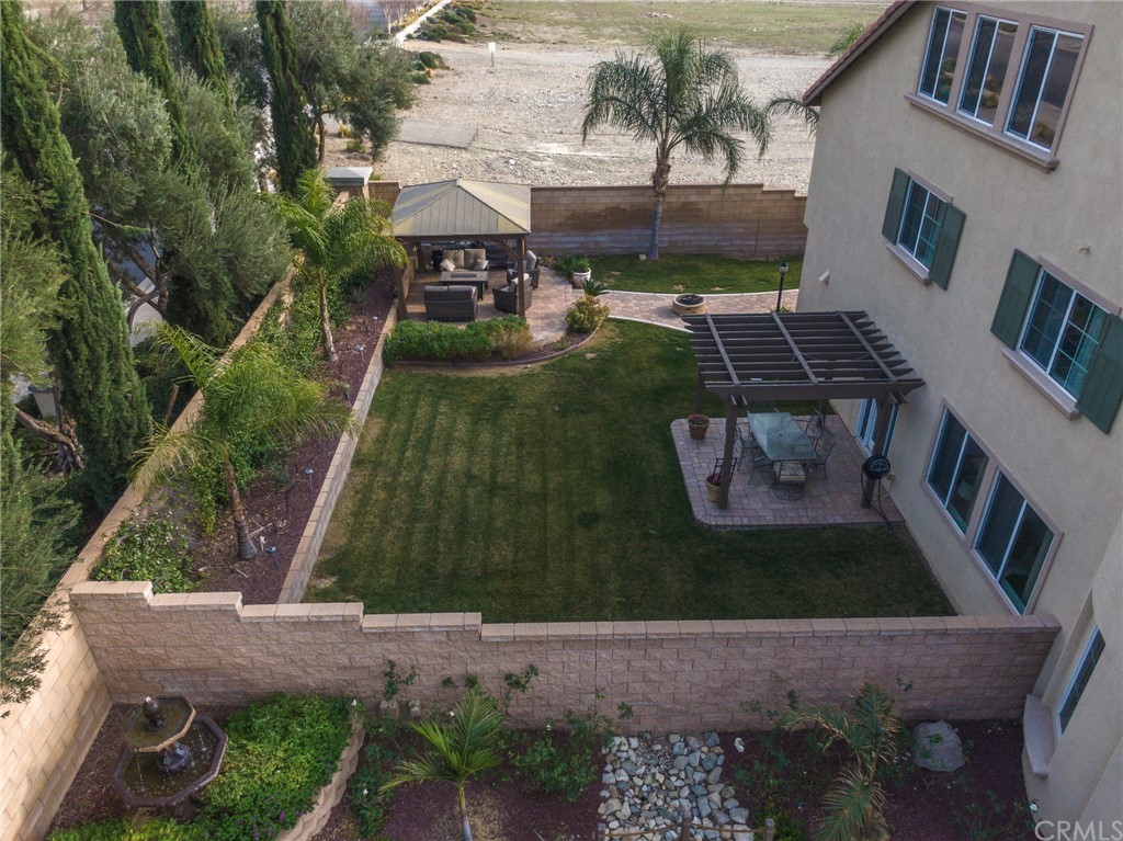 5381 Campania Way Fontana, CA 92336 - Photo 6 of 45 a view of backyard with outdoor seating