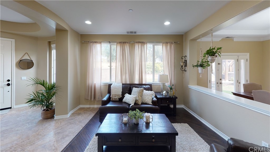5381 Campania Way Fontana, CA 92336 - Photo 8 of 45 a view of a dining room with furniture window and wooden floor