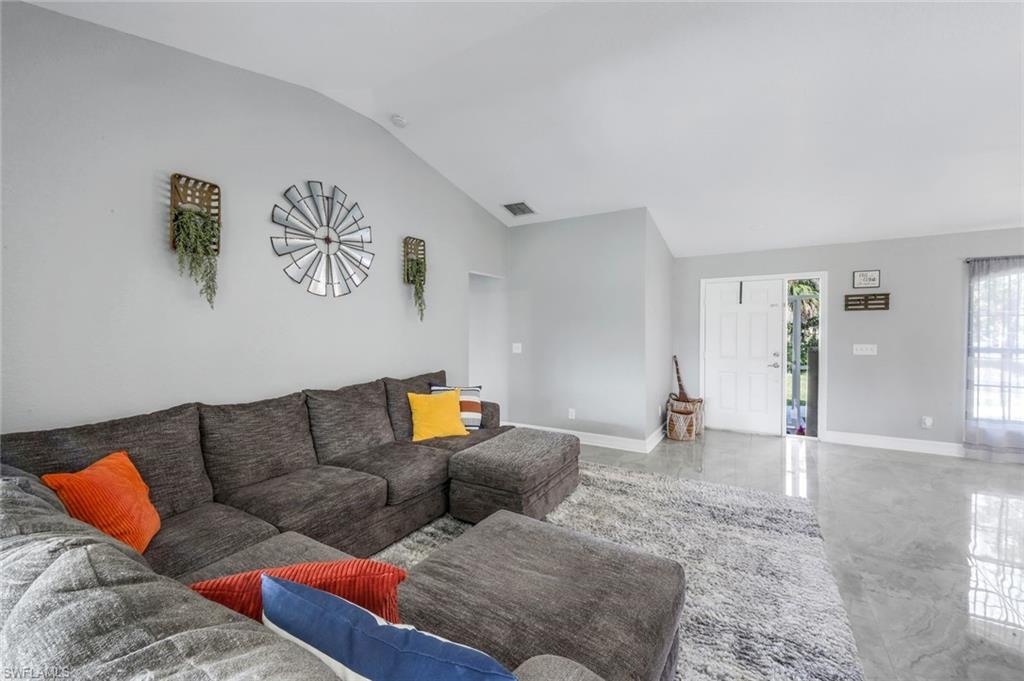 3780 12th Avenue Southeast Naples, FL 34117 - Photo 13 of 43 a living room with furniture and wooden floor