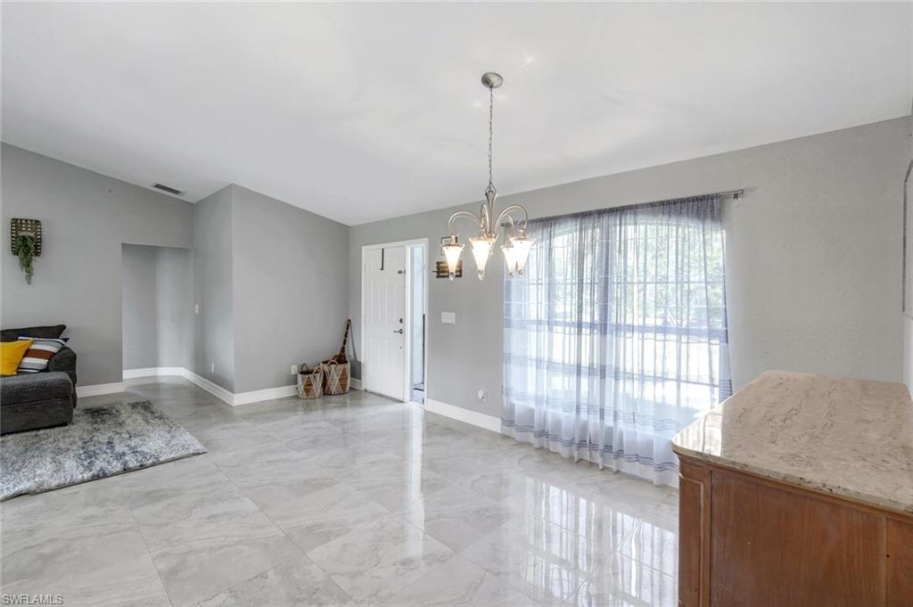 3780 12th Avenue Southeast Naples, FL 34117 - Photo 16 of 43 a view of an empty room with a window