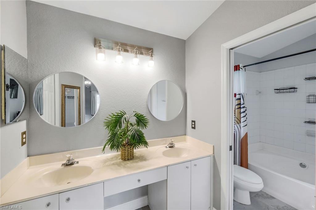 3780 12th Avenue Southeast Naples, FL 34117 - Photo 20 of 43 a bathroom with a double vanity sink mirror and bathtub