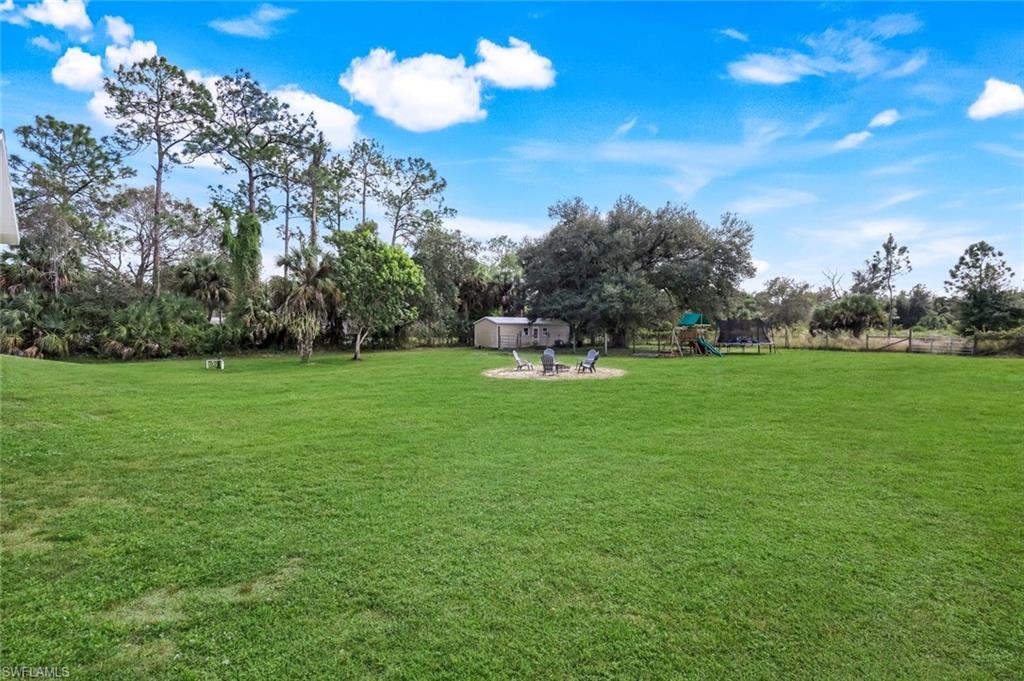 3780 12th Avenue Southeast Naples, FL 34117 - Photo 33 of 43 a view of a golf course with a lake