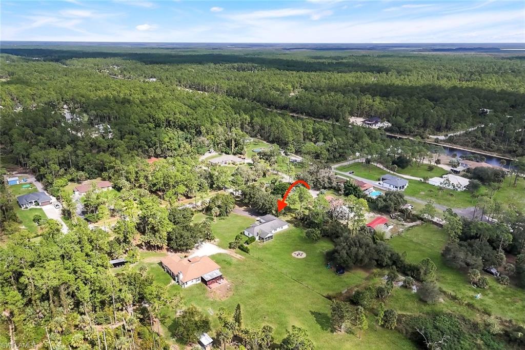 3780 12th Avenue Southeast Naples, FL 34117 - Photo 39 of 43 a view of a lake with a house
