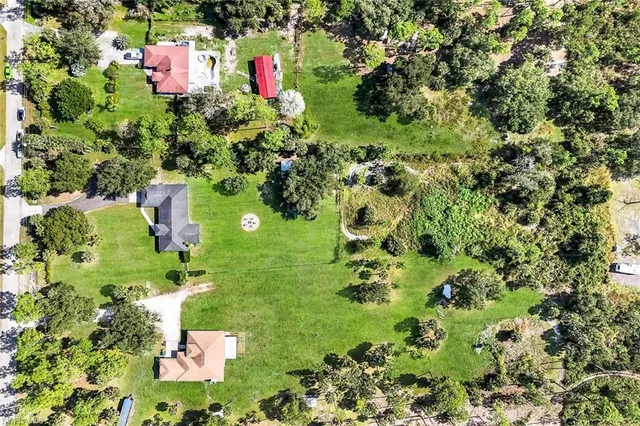 a backyard of a house with lots of green space