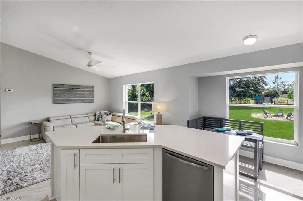 3780 12th Avenue Southeast Naples, FL 34117 - Photo 8 of 43 a kitchen with a sink and a large window