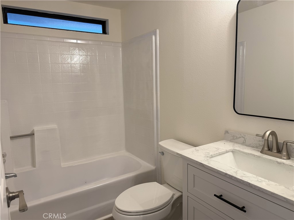 3835 Gardiner Ferry Road, Unit 98 Corning, CA 96021 - Photo 4 of 11 a bathroom with a granite countertop sink toilet and shower