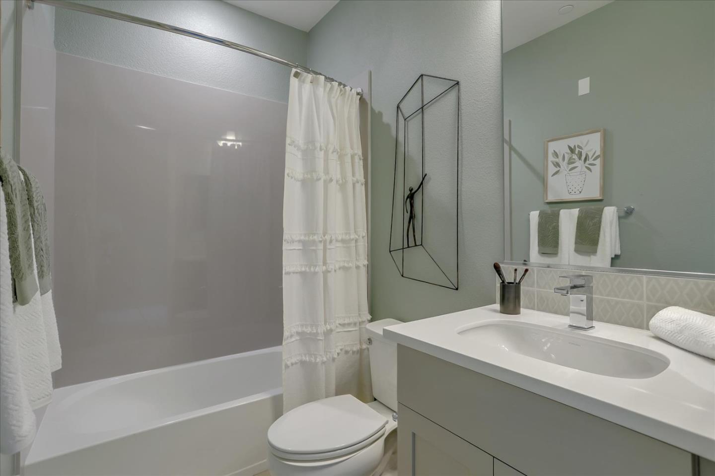 1393 West Middlefield Road Mountain View, CA 94043 - Photo 17 of 21 a bathroom with a sink toilet and shower