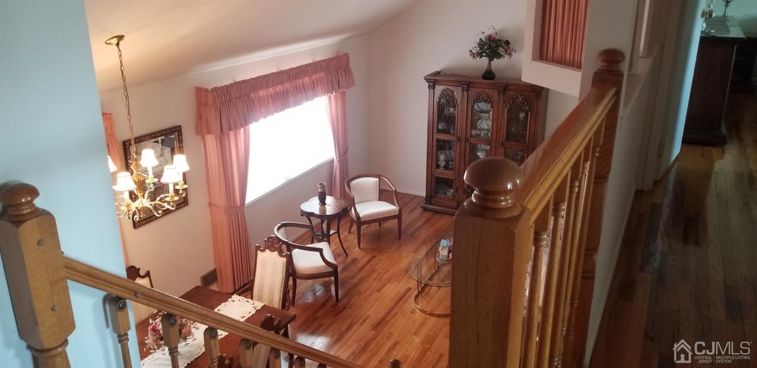 23 Spruce Street Port Reading, NJ 07064 - Photo 16 of 19 a view of a living room with furniture and a window