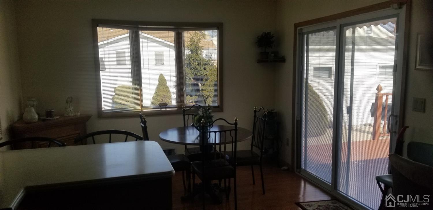 23 Spruce Street Port Reading, NJ 07064 - Photo 17 of 19 a view of a a dining room with furniture window and outside view