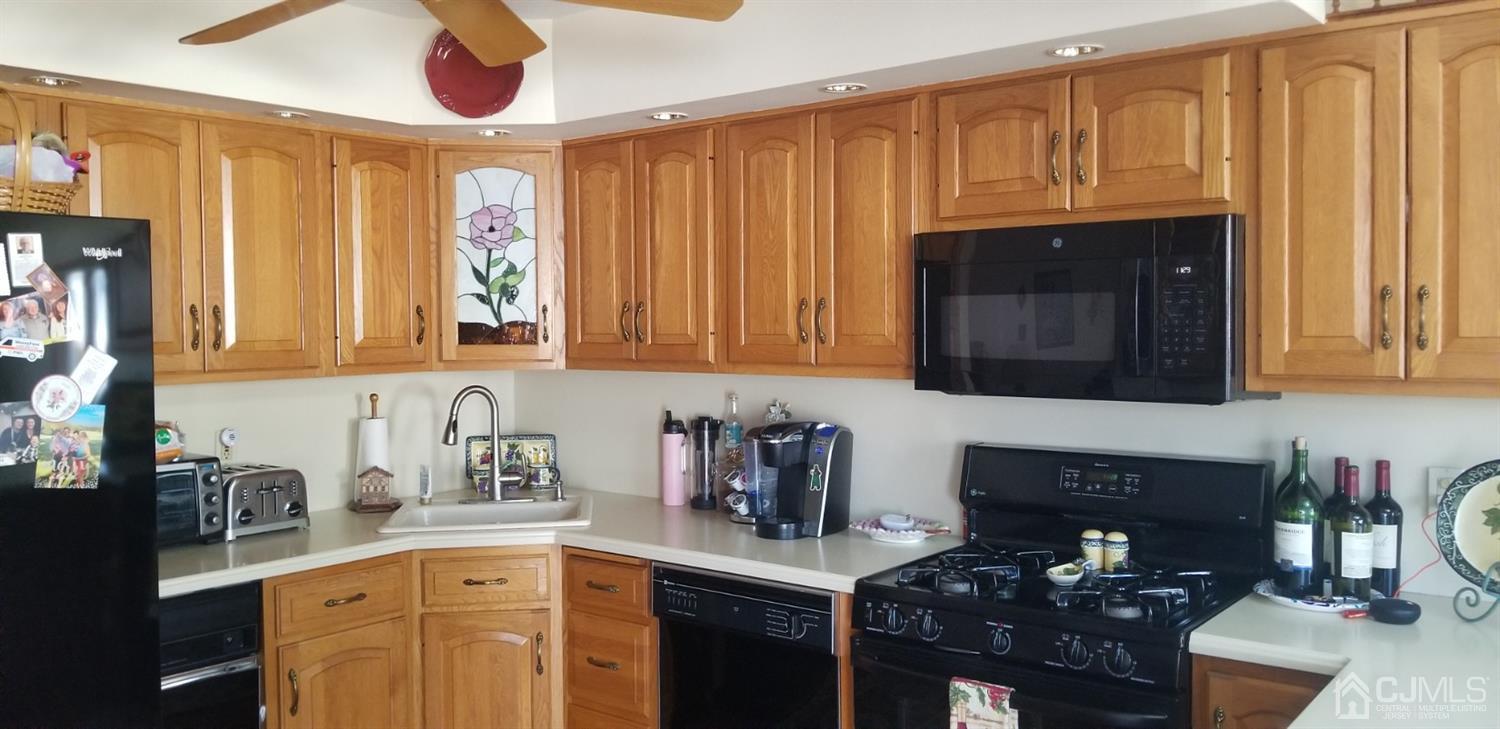 23 Spruce Street Port Reading, NJ 07064 - Photo 6 of 19 a kitchen with a sink cabinets and window