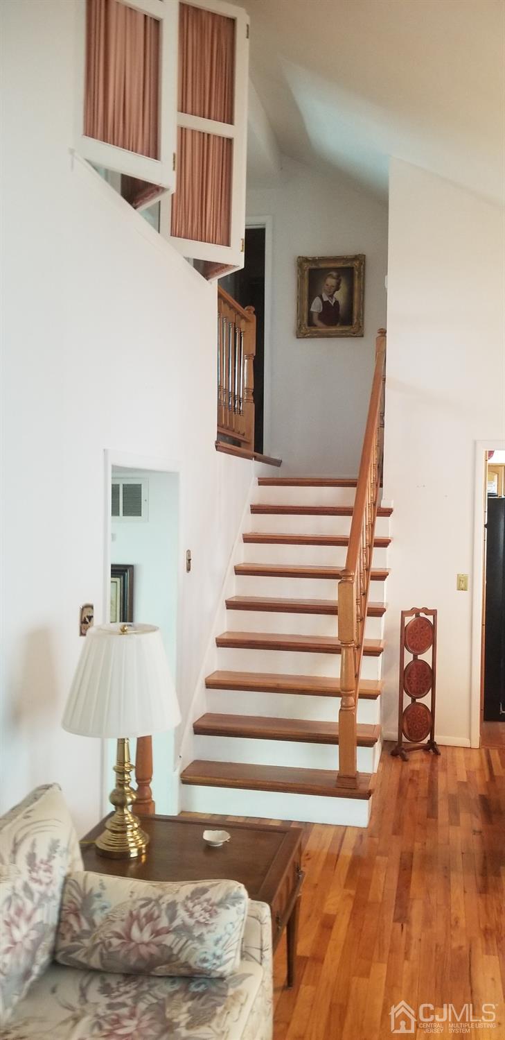 23 Spruce Street Port Reading, NJ 07064 - Photo 8 of 19 a view of entryway and hall with wooden floor