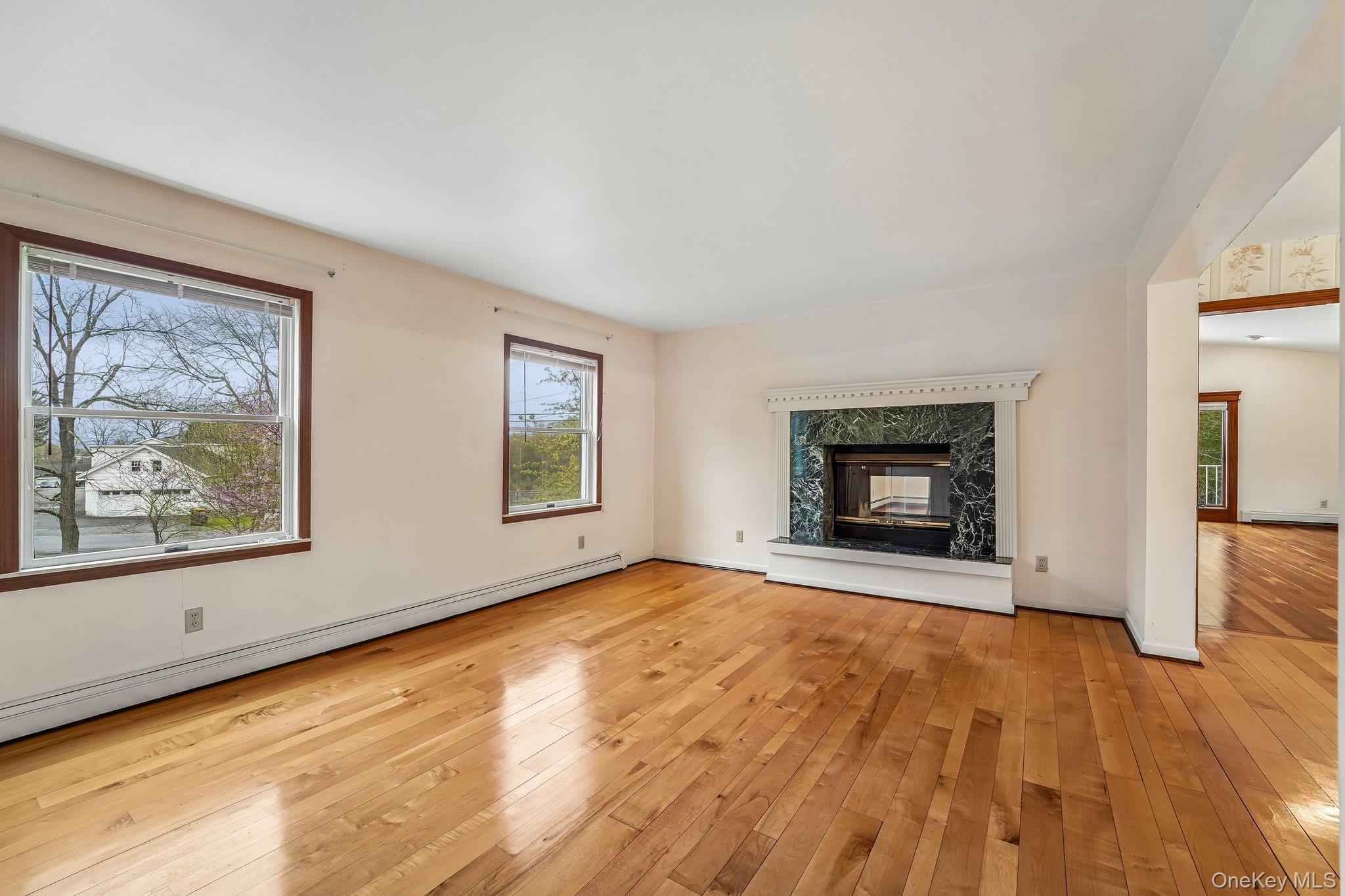 71 4 Corners Road Warwick, NY 10990 - Photo 10 of 48 Living room with double sided fireplace.