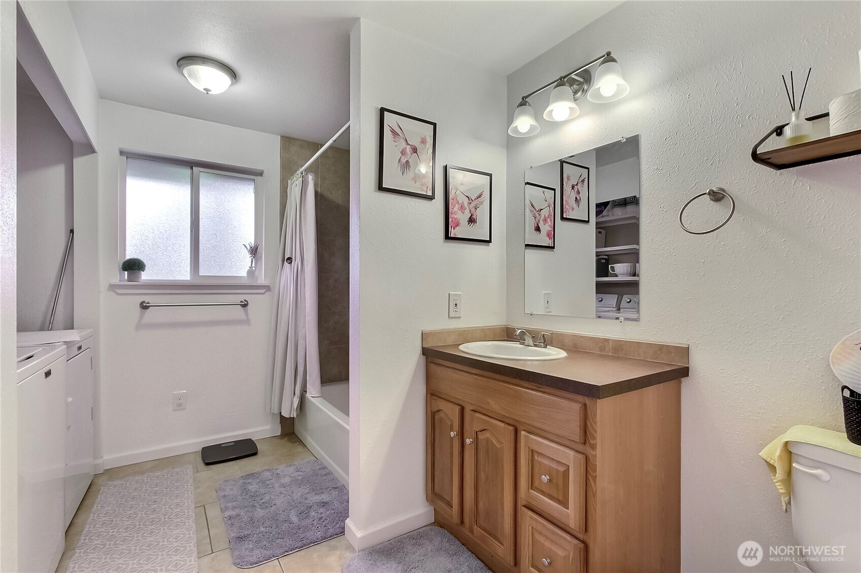 918 Gregory Way Southeast Olympia, WA 98513 - Photo 14 of 21 a bathroom with a sink a toilet and mirror
