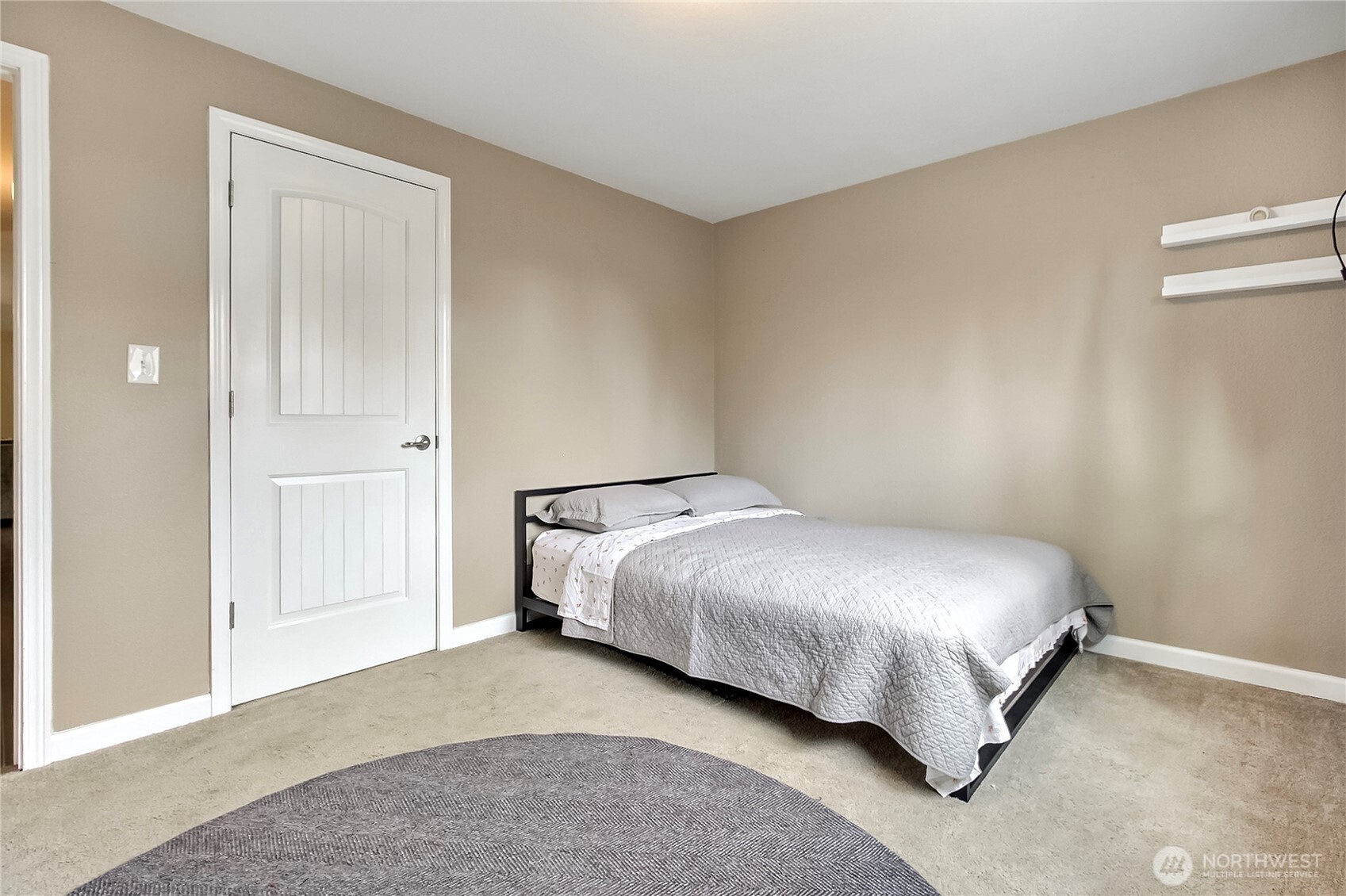 918 Gregory Way Southeast Olympia, WA 98513 - Photo 16 of 21 a bedroom with a bed and painting on the wall