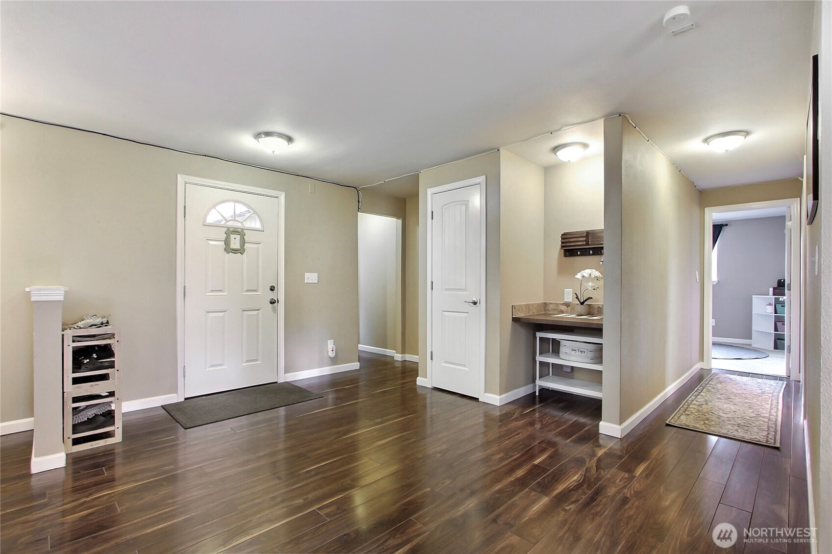 918 Gregory Way Southeast Olympia, WA 98513 - Photo 2 of 21 a view of kitchen with livingroom and wooden floor