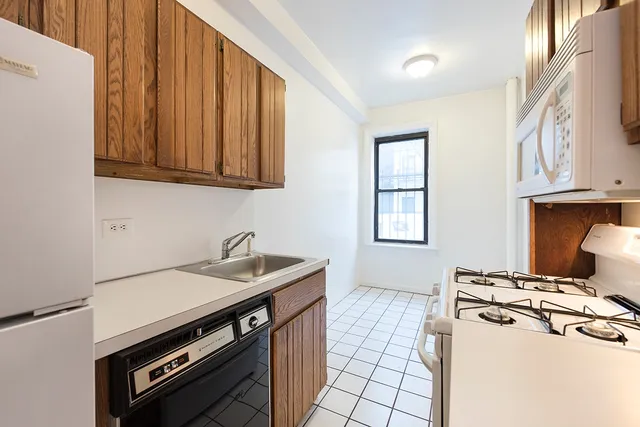 a kitchen with a stove and a sink