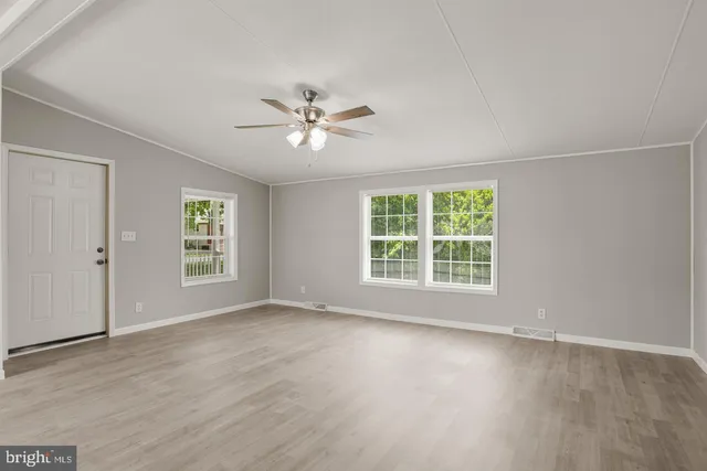 a view of an empty room with a window