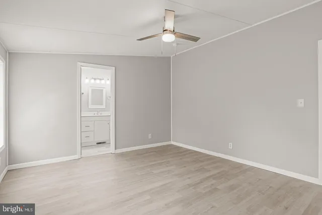 a bedroom with a large bed couch and a window