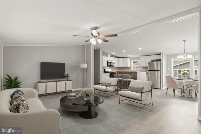a view of kitchen with wooden floor and a window