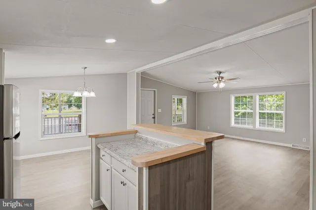 a kitchen with a sink stove and refrigerator