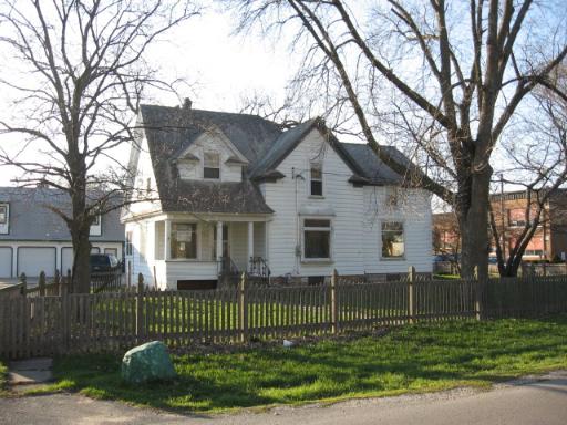 405 Chicago Road Newark, IL 60541 - Photo 1 of 1 a front view of a house with a garden